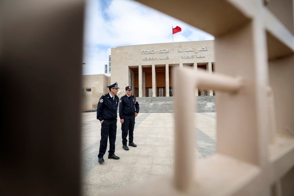 Moroccan policemen stand guard outside the tribunal of Rabat on April 13, 2023.