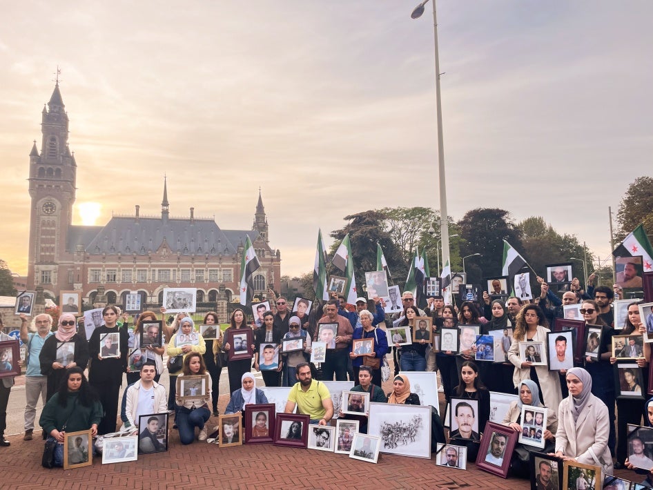 Relatives of Syrians who have been detained or disappeared protest in front of the International Court of Justice in The Hague, Netherlands, on October 10, 2023. 