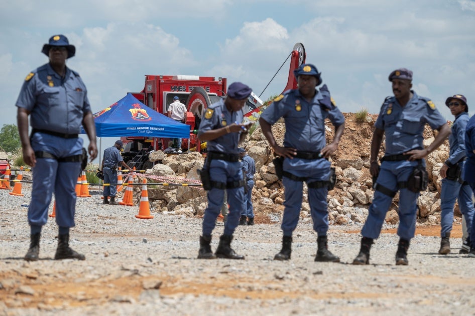 Police maintain a cordon around shaft 11 during rescue operations for trapped miners at the abandoned Buffelsfontein gold mine in Stilfontein, South Africa, January 14, 2025.