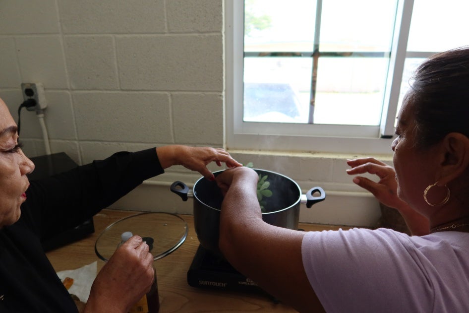 Yo’åmte Auntie Lou Manglona preparing medicine. 