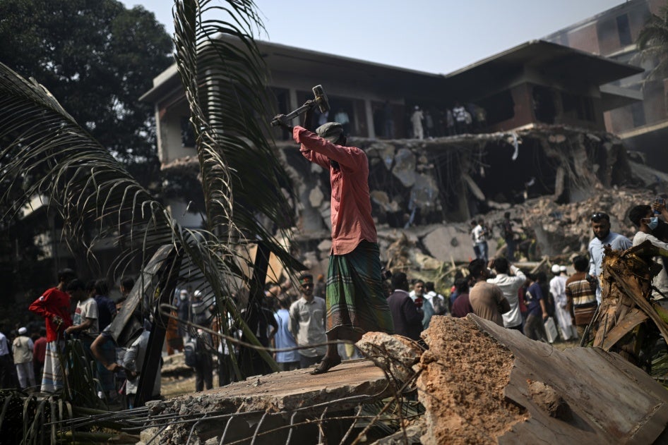 A man hammers the debris around the vandalized residence of Sheikh Mujibur Rahman, Bangladesh's former leader and the father of the country's ousted Prime Minister Sheikh Hasina, in Dhaka, Bangladesh, February 6, 2025.