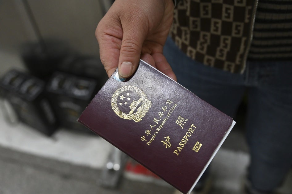 A person holds a Chinese passport