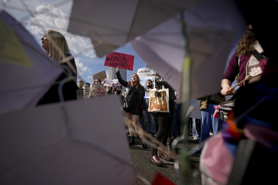 Women take part in a rally dubbed "Our Uterus is not your profit" to raise awareness on the difficulties of getting an abortion in a state hospital, during International Women's Day outside the government headquarters in Bucharest, Romania, March 8, 2023.