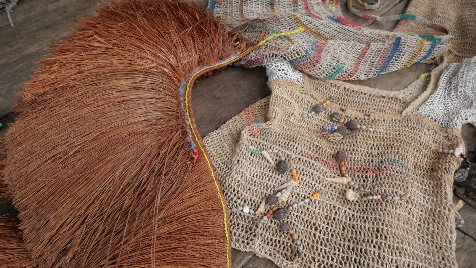 Traditional accessories made from natural materials such as fruits, seeds, shells, and bark foraged from the surrounding forest are commonly used by local residents during cultural events, in Ampera village, Mandobo district, Boven Digoel Regency.