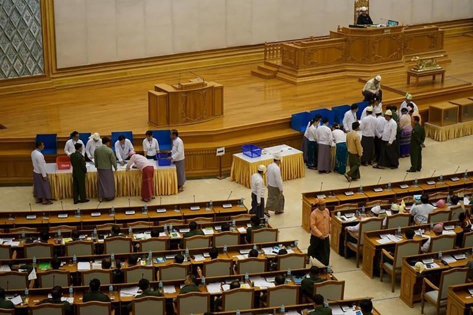 Members of parliament cast ballots in Naypyitaw on June 25, 2015. 