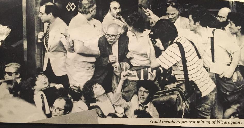 Michael Ratner (far right) and Reed Brody (fist raised) at 1984 protest of US support for Nicaraguan “contras”