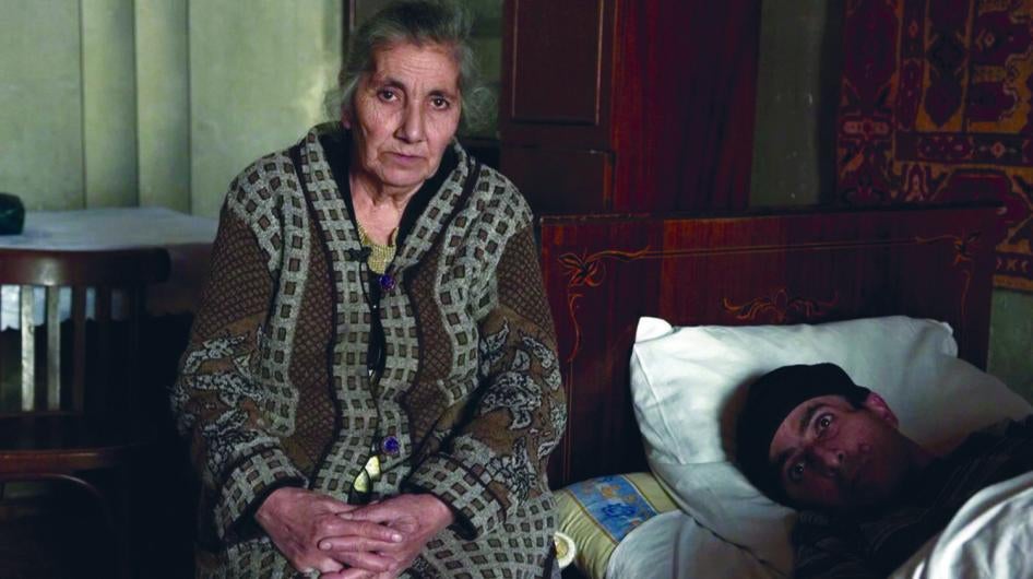 Gurgen G., who had a brain tumor, and his mother. Gurgen participated in a palliative care pilot project, which improved the quality of his remaining life. He died in August 2012, free from pain. 