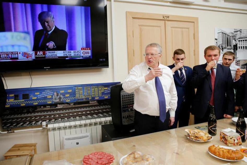 Head of the Liberal Democratic Party of Russia (LDPR) Vladimir Zhirinovsky celebrates Donald Trump's election as president by drinking sparkling wine with other party members during a break in the session of the State Duma