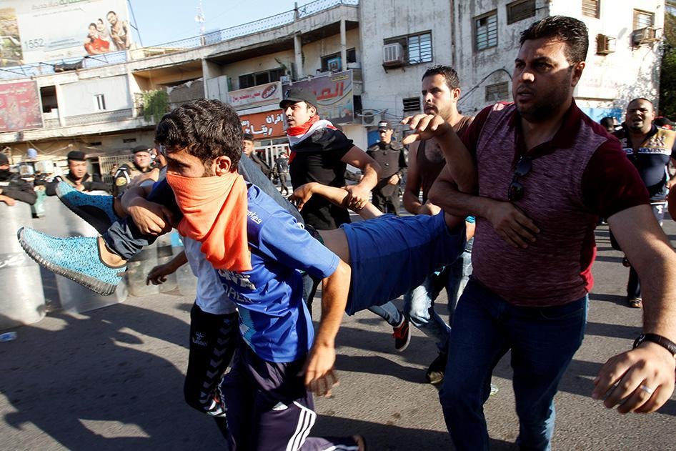 iraq protests killed baghdad 2.ar