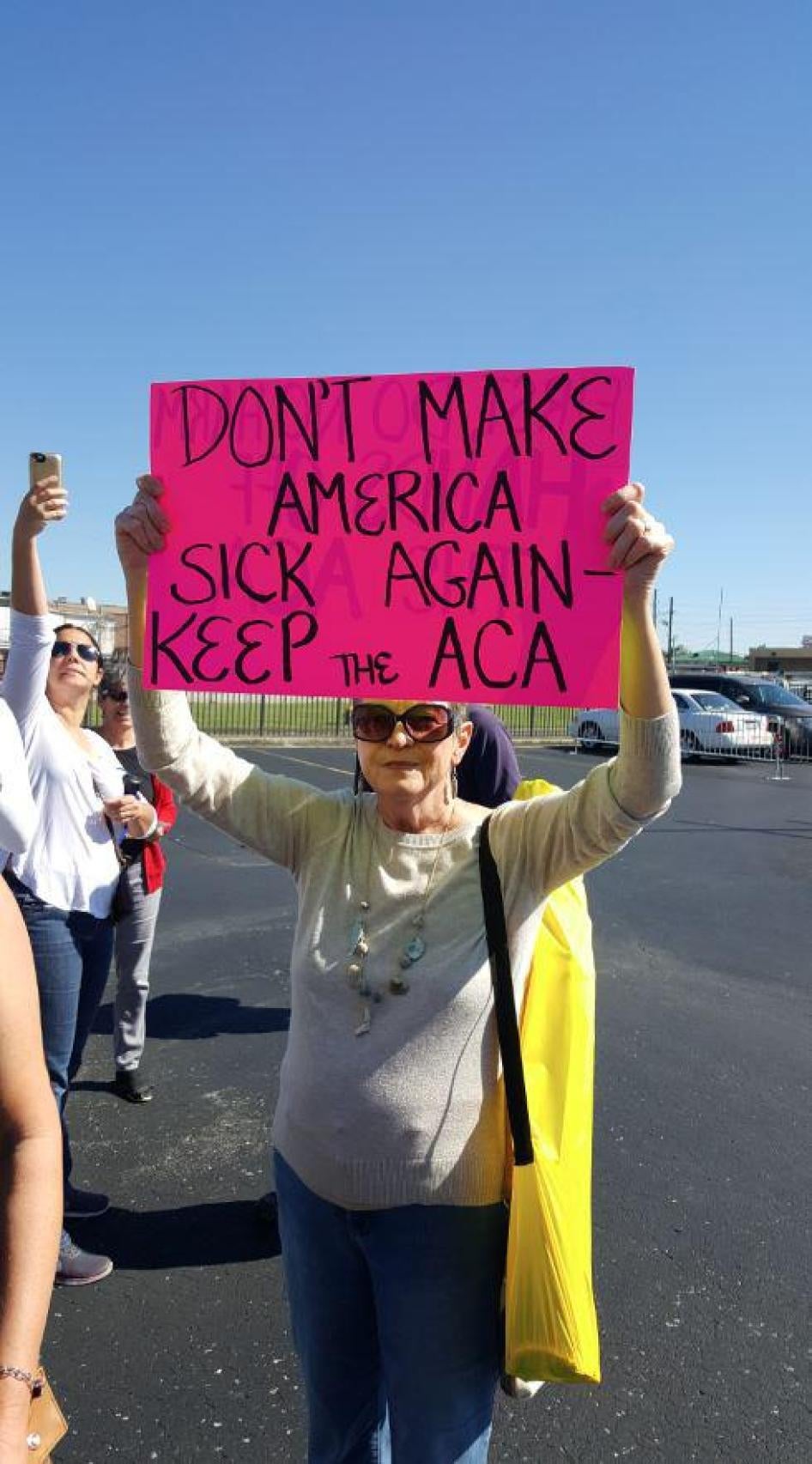 A protester holds a sign at Louisiana Republican Senator Bill Cassidy's town hall meeting in Metairie, Louisiana, February 22, 2017. 