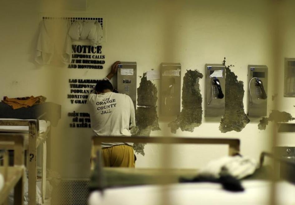 An inmate makes a phone call from his cell at the Orange County jail in Santa Ana, California, May 24, 2011.