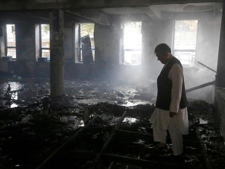 A man inspects a Shia mosque after an attack claimed by the Afghan affiliate of the Islamic State in Kabul, Afghanistan, August 25, 2017. 