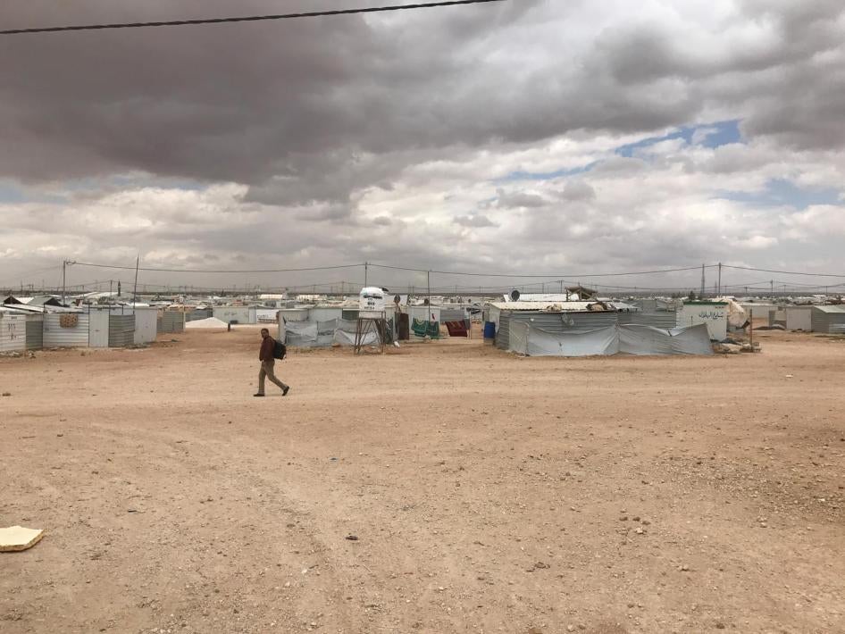 A lone man crosses Zaatari refugee camp in Jordan. The camp population fell from 203,000 during its peak in April 2013 to 80,000 by July 2017.  