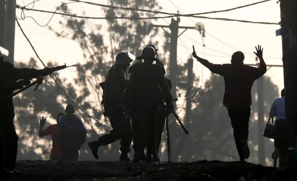 An opposition supporter gestures in front of policemen during clashes in Kawangware slum in Nairobi, Kenya October 30, 2017.
