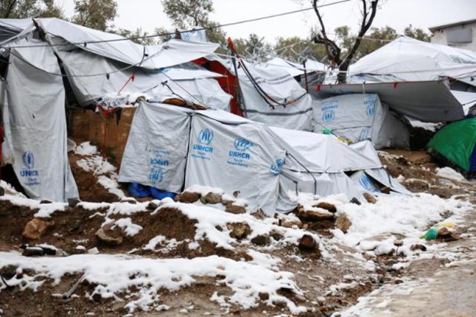 Snow lays next to tents provided by the UNHCR at the refugee camp of Moria on the Greek island of Lesbos, January 10, 2017.