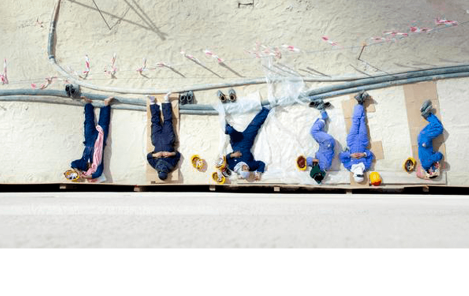 Foreign workers take a break during lunch at a building site in Kuwait City, October 21,2013. 