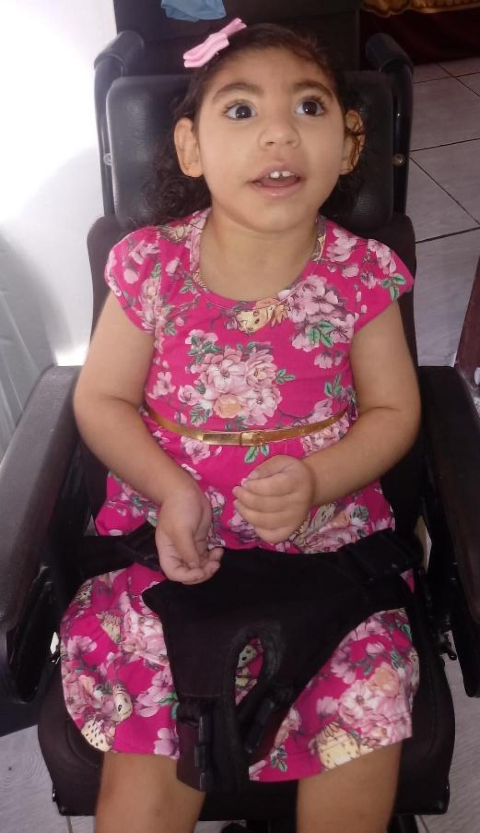 Gaby in her chair, which she needs to move around her home safely 