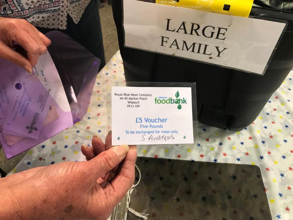 Volunteers at the Wisbech food bank, Cambridgeshire make up an emergency parcel suitable for a large family, April 20. This food bank can sometimes offer families with children an additional £5 voucher to be redeemed at the local butcher or greengrocers. 