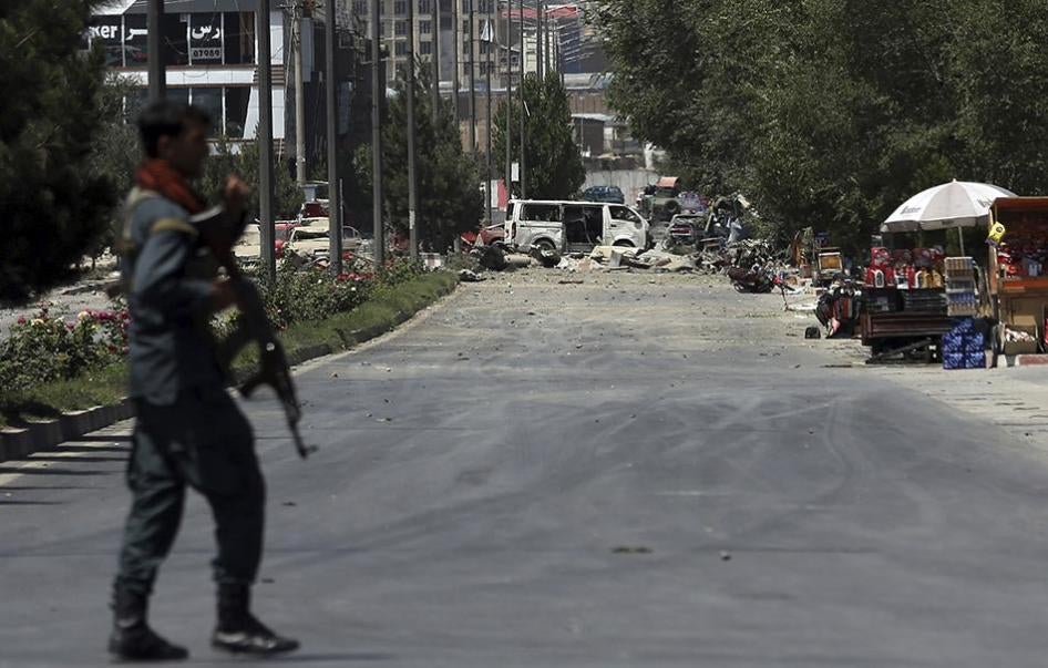 A security forces soldier arrives at the site of an explosion in Kabul, Afghanistan