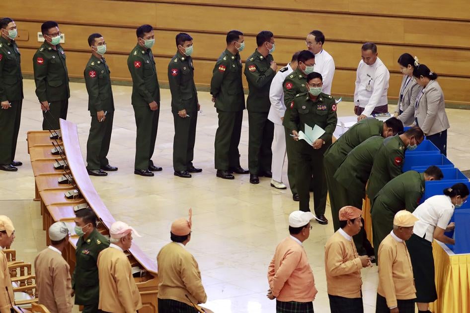 Military and civilian members of parliament vote on proposed amendments to the 2008 Constitution, Naypyidaw, March 10, 2020.