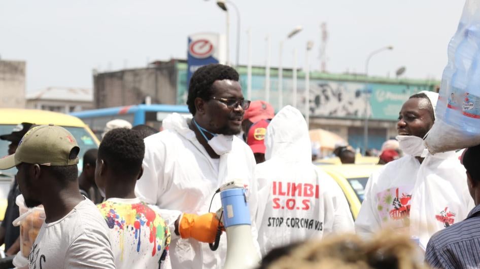 Pro-democracy activists from Filimbi movement raise awareness about the COVID-19 pandemic in Kinshasa’s Gambela market, Democratic Republic of Congo, March 28, 2020.