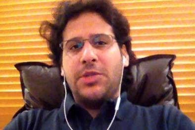 A man in glasses wearing headphones