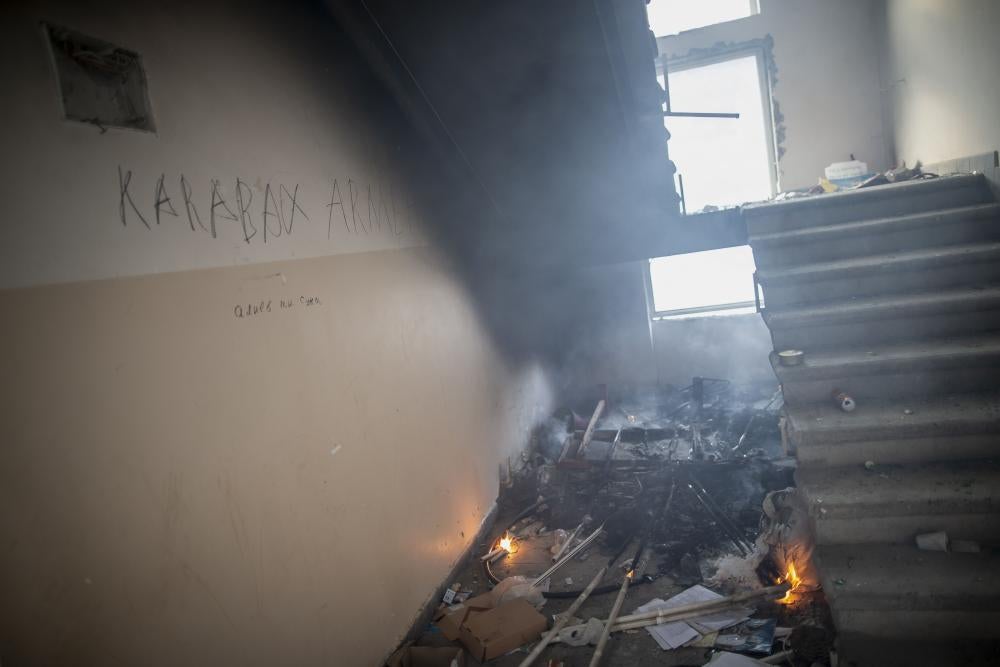 Two small fires burn in a school stairwell