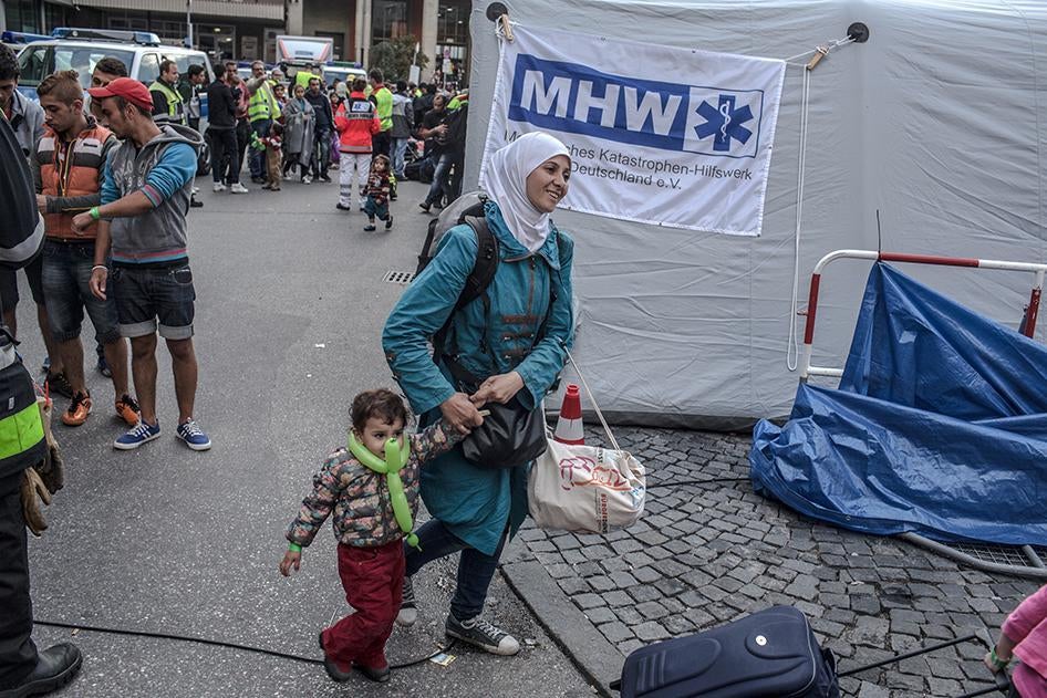 A Syrian refugee and her child arrive at the main train station in Munich, Germany on September 5, 2015. 