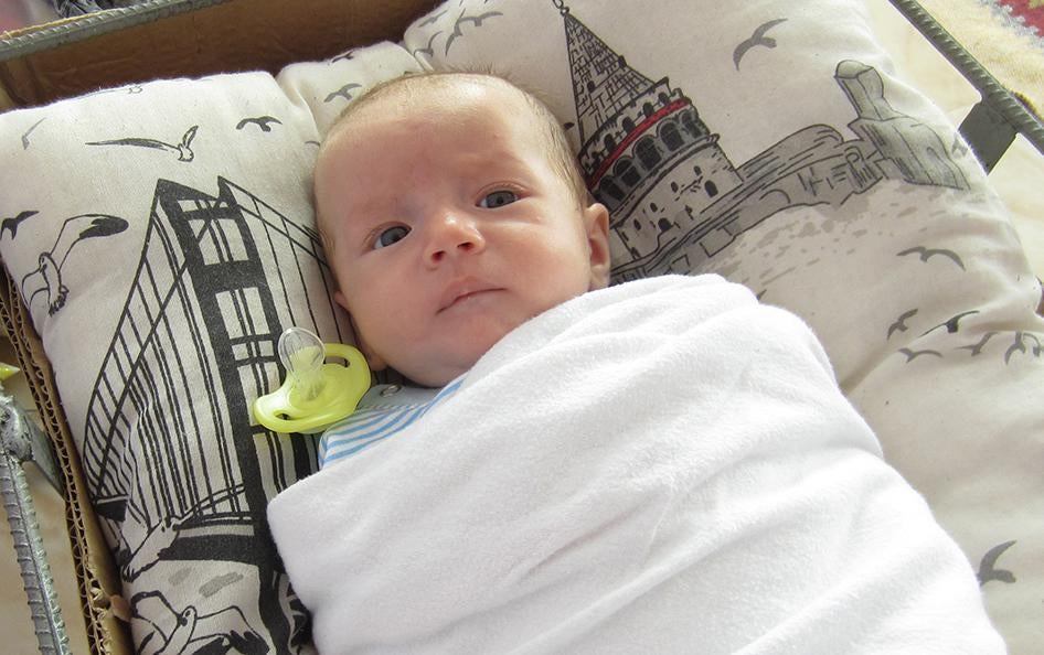 Amad, 2 months old, is one of four young siblings whose parents were killed by armed militants believed to be Islamic State fighters during an attack on Kobani, Syria. Nine other members of the family also died. 