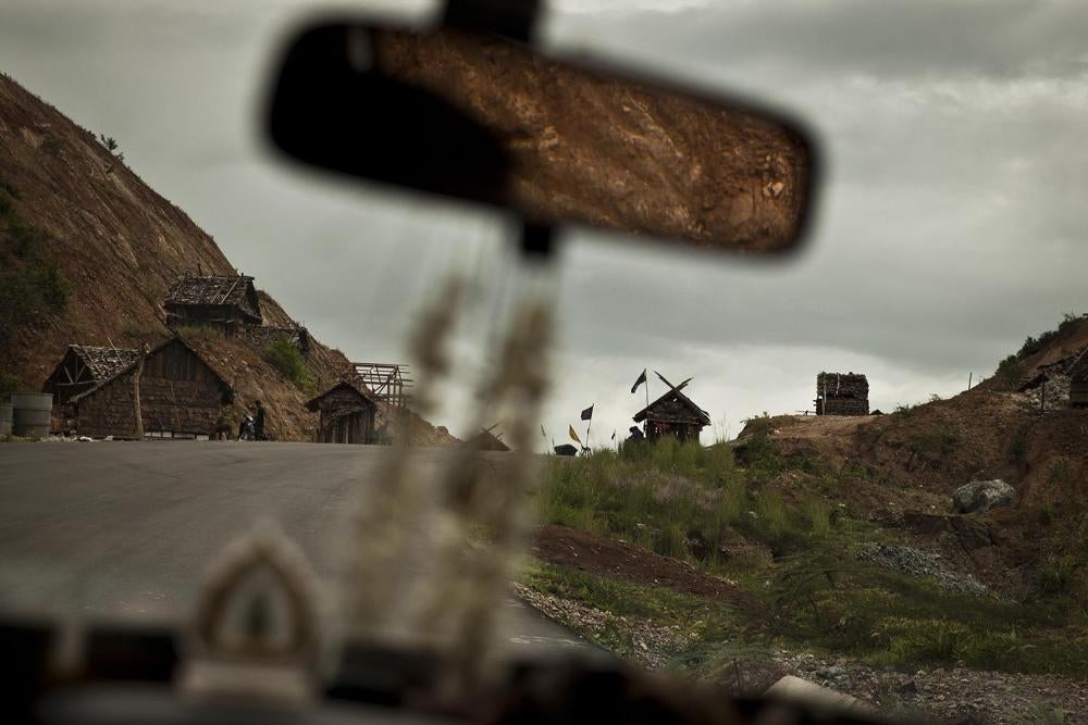 Toll booths operated by militias on a new road financed by Thailand from Kawkareik to the border town of Myawaddy in Burma. Armed men at the tolls lack military insignia or other distinguishing marks on their uniforms, and charge 1000 to 2000 Burmese kyat