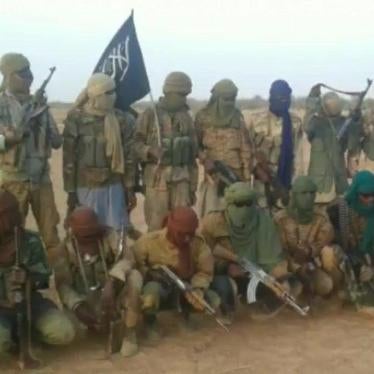 A group of armed men pose for a photo