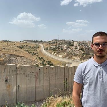 Laith Abu Zeyad, a campaigner for Amnesty International, in front of Israel’s separation barrier in Jerusalem.