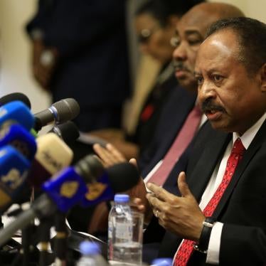 Sudanese Prime Minister Abdalla Hamdok (R) attends the opening session of the "Friends of Sudan" conference in the capital Khartoum on December 11, 2019.