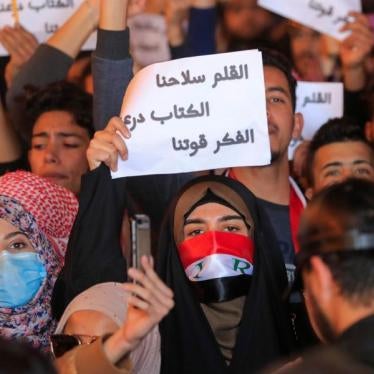 Woman holding up a sign during a protest