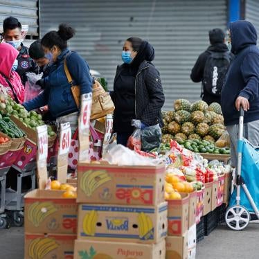 People line up outside a grocery store in the Sunset Park neighborhood of Brooklyn, New York, May 11, 2020.