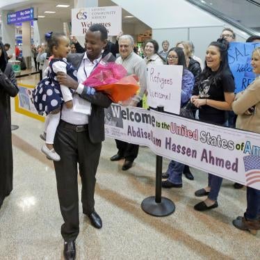 Abdisellam Hassen Ahmed, a Somali refugee who had been stuck in limbo after President Donald Trump temporarily banned refugee entries, walks with his wife Nimo Hashi, and his 2-year-old daughter, Taslim, who he met for the first time after arriving at Salt Lake City International Airport, February 10, 2017.