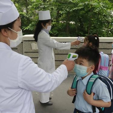 Kim Song Ju Primary school students have their temperatures checked before entering the school in Pyongyang, North Korea. 
