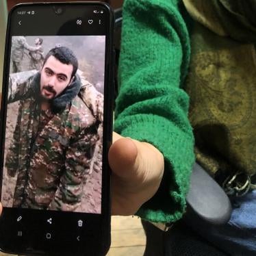 Liana Harutyunyan shows Human Rights Watch an image of her nephew Eric Khachaturyan, a prisoner of war (POW) in Azerbaijan, taken from a video in which he and other POWs are abused. Yerevan, November 2020.