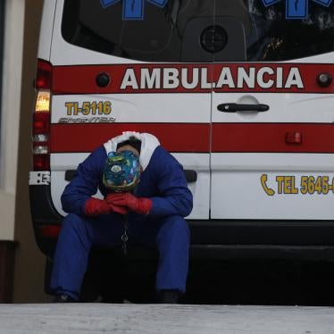 A paramedic rests behind his ambulance, as ambulance staff wait hours for the Covid-19 patients they are transporting to be admitted, at Siglo XXI National Medical Center in Mexico City, Thursday, Jan. 7, 2021. 