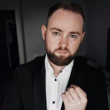 Ilya Bronsky wearing a jacket and shirt