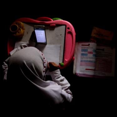 An overhead shot of a student on a cell phone