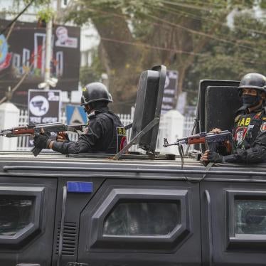 Rapid Action Battalion (RAB) officials stand alert inside a truck in front of Central Shaheed Minar in Dhaka, Bangladesh on February 20, 2021.