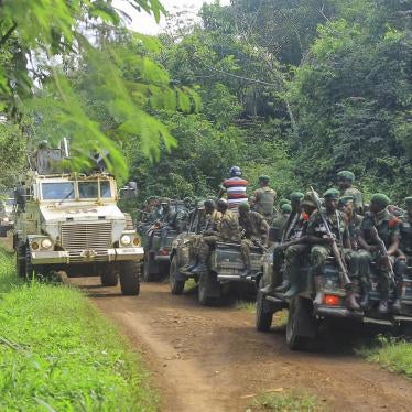 Congolese army soldiers and United Nations peacekeepers patrol the area of an attack near the town of Oicha, 30 kilometers from Beni, eastern Democratic Republic of Congo, July 23, 2021.