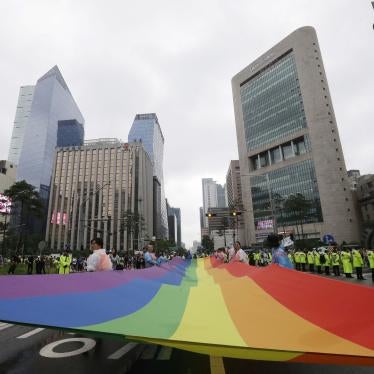 Participants march with a rainbow flag during a gay pride parade in Seoul, South Korea.