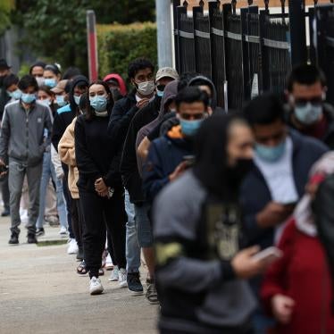People wait outside a Covid-19 vaccination clinic in the Bankstown suburb during a lockdown in Sydney, Australia, August 25, 2021.