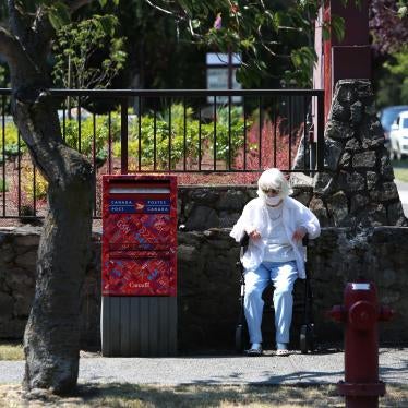 A woman sits to take a rest as heat wave hits Western Canada on June 30, 2021 in Victoria, British Columbia, Canada. © 2021 Mert Alper Dervis/Anadolu Agency via Getty Images