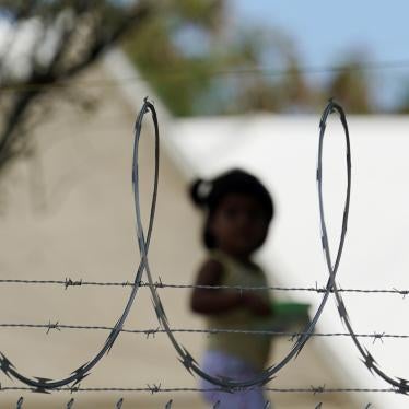 A child plays at a camp for US asylum seekers in Matamoros, Mexico, a city south of the Texas border where hundreds have been waiting under the "Remain in Mexico" program, on November 18, 2020.
