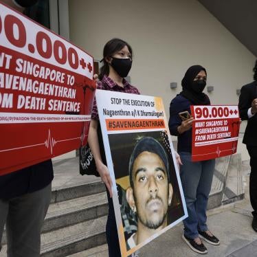 A group of people holding protest signs