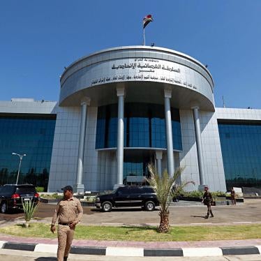 A security officer stands outside a building