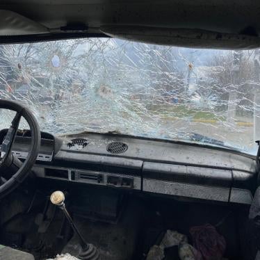 Maksym Maksymenko’s shot-up car in Hostomel, Ukraine. Russian forces opened fire on the vehicle on February 28, 2022 while Maksym was trying to evacuate with his mother, mother-in-law, wife, and their toddler son. Maksym and his wife were wounded, his mother died.